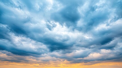 Obraz premium Dramatic Stormy Cloudscape with Blue Hour Colors and Golden Sunset