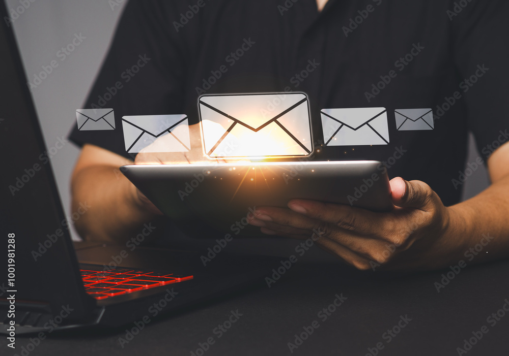 Poster man using tablet to check emails with digital notifications.