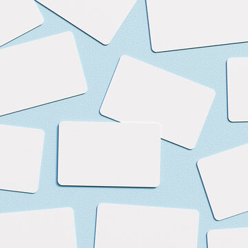 Scattered Blank White Cards on Blue Background