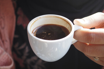 woman drinking turkish coffee at cafe 