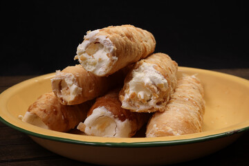 Bangladesh Indian cone shaped hard flaky puff pastry stuffed cream roll