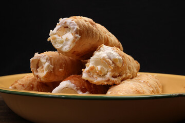 Bangladesh Indian cone shaped hard flaky puff pastry stuffed cream roll