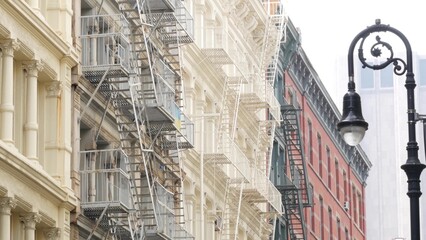 New York City Manhattan Soho fashion district near Broadway street. USA urban building facade, old...