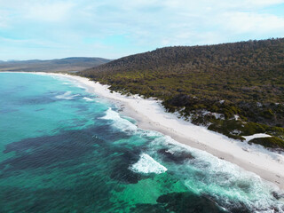 Aerial views over white sandy beach in Tasmania, Australia