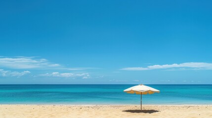 Peaceful Beach Scene with Umbrella and Clear Sky