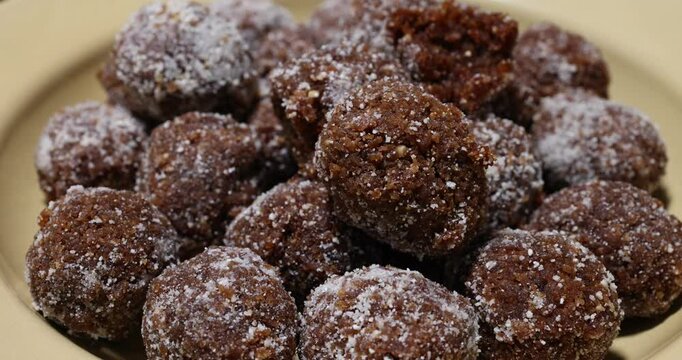 Traditional sweet treat Narkel Naru Coconut ladoo laddu with Jaggery