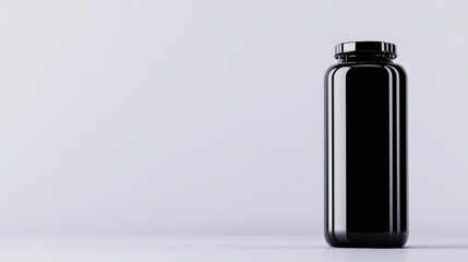 Black supplement bottle on a white isolated background.