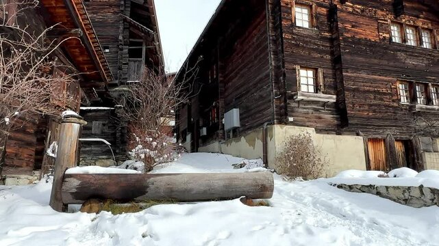 Timber Lodging Apartment Accommodation Near Alpine Mountains During Winter In Switzerland. Static Shot