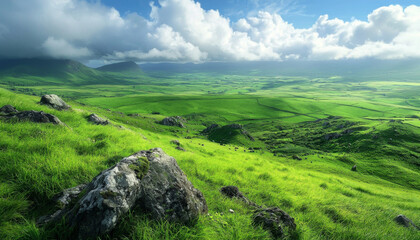 Obraz premium A breathtaking landscape showcasing lush green fields, rocky formations, and dramatic clouds under a bright sky.