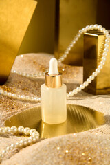 Cosmetic advertising poster in luxury style, from high angle shot. An unbranded serum bottle placed on a gold showcase platform, decorated around with golden geometric podium and pearl jewelry