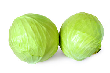 Obraz premium Two fresh heads of cabbage on a white background. Round whole cabbage on a white background.