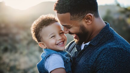 Fototapeta premium A joyful father and son share a warm embrace, both smiling under the soft sunlight in an outdoor setting.