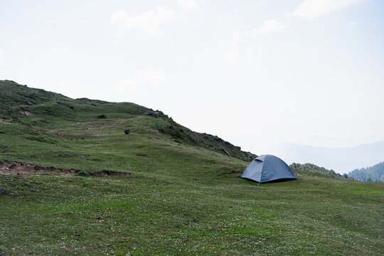 Camping tent outdoor. Camping leisure and destination travel near green forest mountain.Tourism relax and chill in  Tirthan Valley,Shangarh himachal pradesh india.