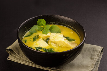 Thai Fish Curry with Coconut Milk and Thai Basil.