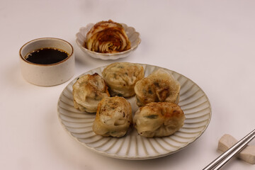 Fried Mandu or Korean Dumpling Served With Kimchee.