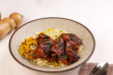 Huli-Huli Chicken is Hawaiian Grilled Chicken Infused with Sweet and Tangy Marinated from Pineapple, Served with Rice. 