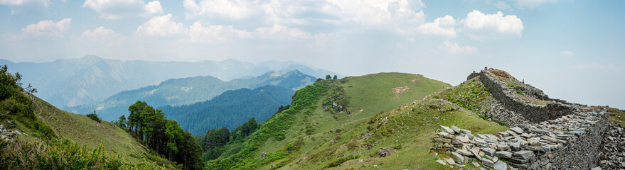 Fototapeta premium Panoramic landscape View from the top of Raghupur Fort - Tirthan Valley Himachal Pradesh India. 