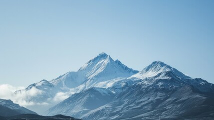 Obraz premium Majestic Snow-Capped Mountains Under Clear Sky