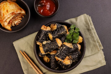 Ayam Gulung Nori or Chicken Nori Roll Gimmari or Kimmari is Korean Snack Made from Minced Chicken with Seaweed Wrap. © menik