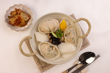 Tteok Mandu Guk is Korean Dumpling and Rice Cake Soup for New Year Celebration.