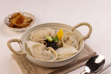 Tteok Mandu Guk is Korean Dumpling and Rice Cake Soup for New Year Celebration.
