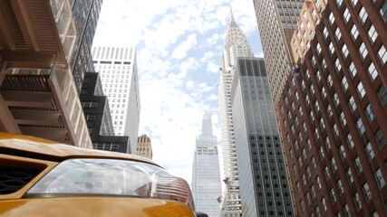 New York City Manhattan Midtown 42 street architecture. Chrysler building, iconic high-rise skyscraper, USA. American urban cityscape, famous NYC Vanderbilt tower, yellow taxi United States. Low angle