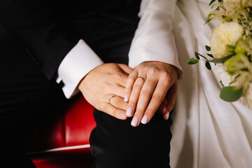 bride and groom holding hands