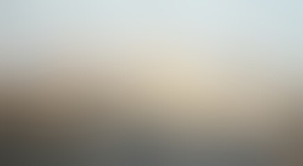 Muted grey plain empty backdrop. Blurred graphic.