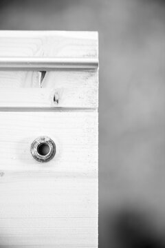 Black and white picture of Detail of wooden boards being assembl