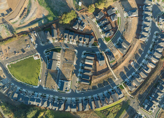 A view of a residential neighborhood with houses and a street