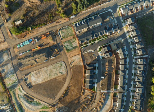 A view of a residential area with houses and a construction site