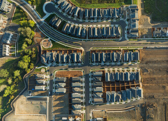 A view of a residential neighborhood with many houses and a street