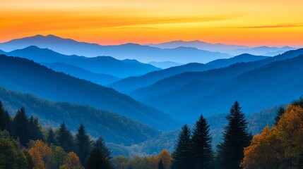 Obraz premium Golden sunrise illuminates the smoky mountains with layers of blue hills and autumn foliage in a peaceful morning landscape