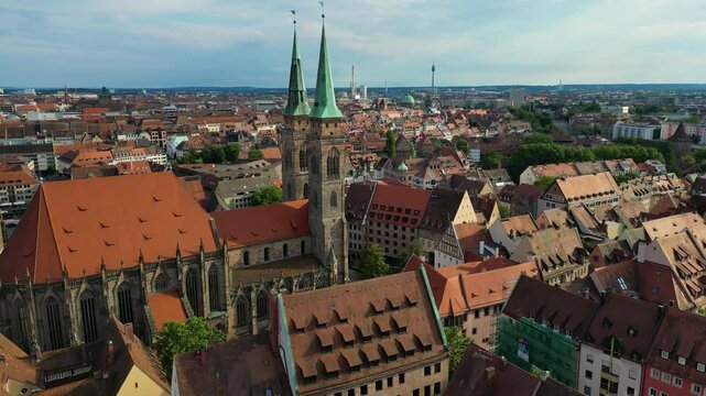 4K Aerial Drone Video of the Twin Spiers and Stained Glass Windows of the Beautiful St. Sebald Church in Downtown Nurnberg, Germany