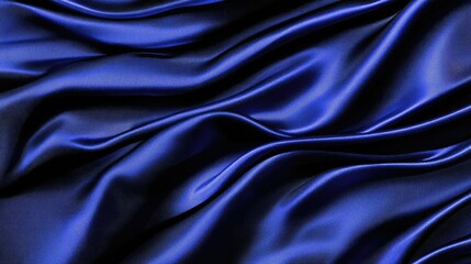 Fototapeta premium Luxurious blue satin fabric with soft, flowing folds creating a smooth and glossy texture, ideal for backgrounds, fashion, or textile design projects