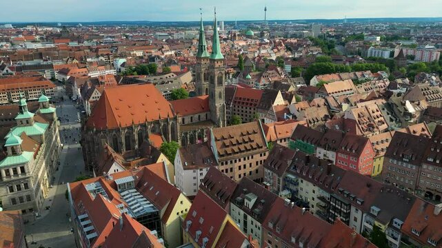 4K Aerial Drone Video of the Twin Spiers and Stained Glass Windows of the Beautiful St. Sebald Church in Downtown Nurnberg, Germany