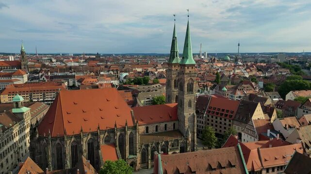 4K Aerial Drone Video of the Copper-clad Twin Spiers on the Beautiful St. Sebald Church in Downtown Nurnberg, Germany