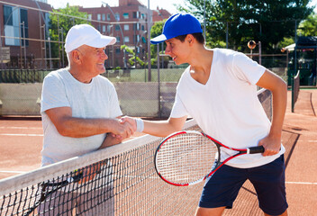 Tennis players shake hands before tennis match