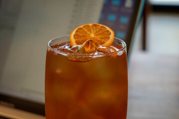 glass of orange juice with ice