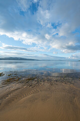Wooden walking track built on the sea. Wooden bridge by the sea. Walking track with wooden floor and iron railings built in the sea. Quay walking area. Sea of ​​Erdek.