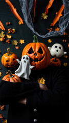 Person wearing a pumpkin on their head for Halloween