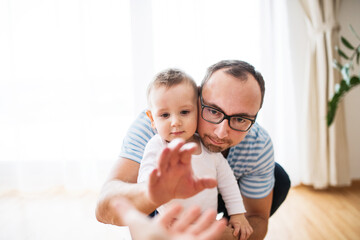 Portrait of father with little son.