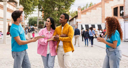 Volunteers Engaging with a Couple at an Outdoor Event