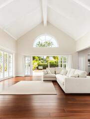 Fototapeta premium Bright, airy living room with high ceilings and large windows overlooking a lush garden in a contemporary home