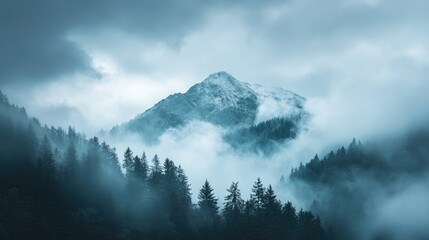 Mountain peak shrouded in mist. Ideal for nature, travel, and weather themes.