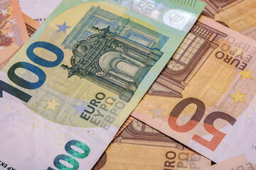 Close-up of scattered moneys. Euro banknotes as a background. Financial background photo.