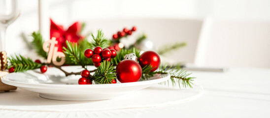 Christmas Table Setting with Red Ornaments and Pine Sprigs