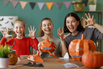 Happy family preparing for Halloween.