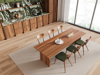 Modern kitchen interior with wooden cabinets, a marble backsplash, and a wooden dining table with green chairs, set in a spacious, clean room with large windows. Contemporary home design. 3D Rendering