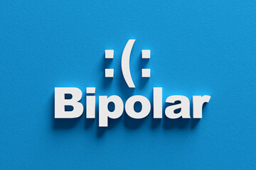 Bipolar disorder concept showing sad and happy moods